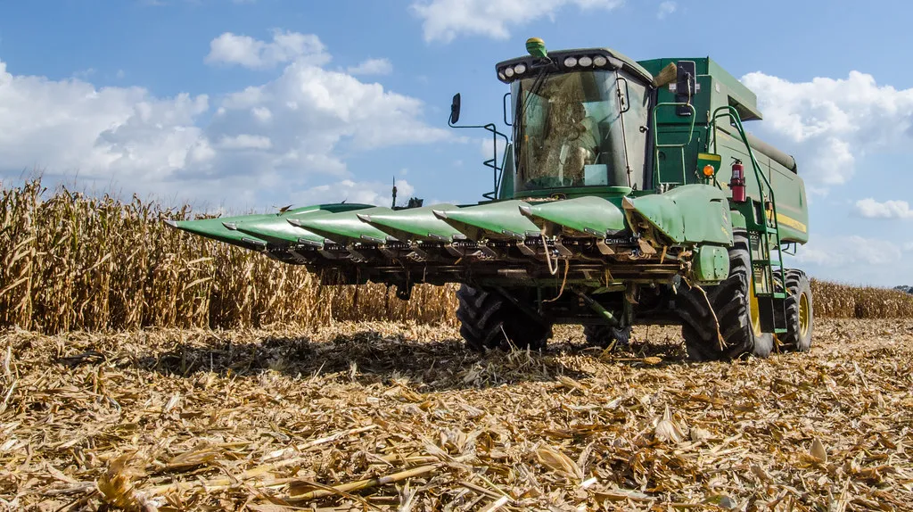 Combine harvester working across a commercial-scale crop field